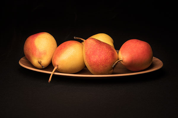 pears on a wooden plate